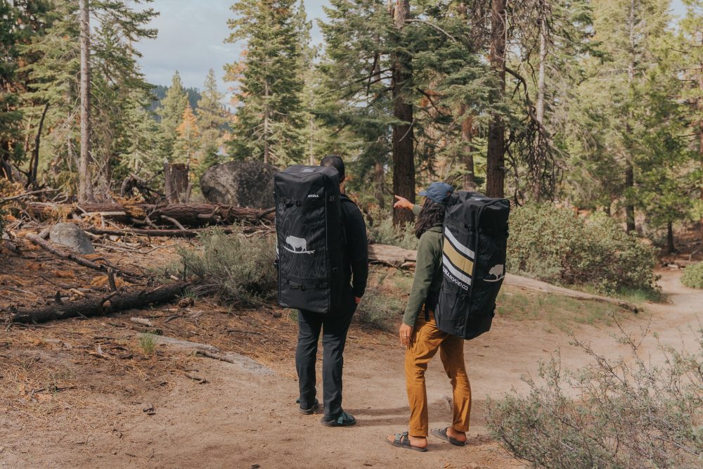 Two Paddler Boarders with Backpacks