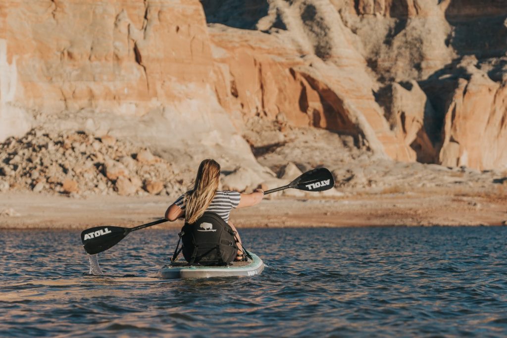 Rear View of Paddle Boarder on Atoll Board
